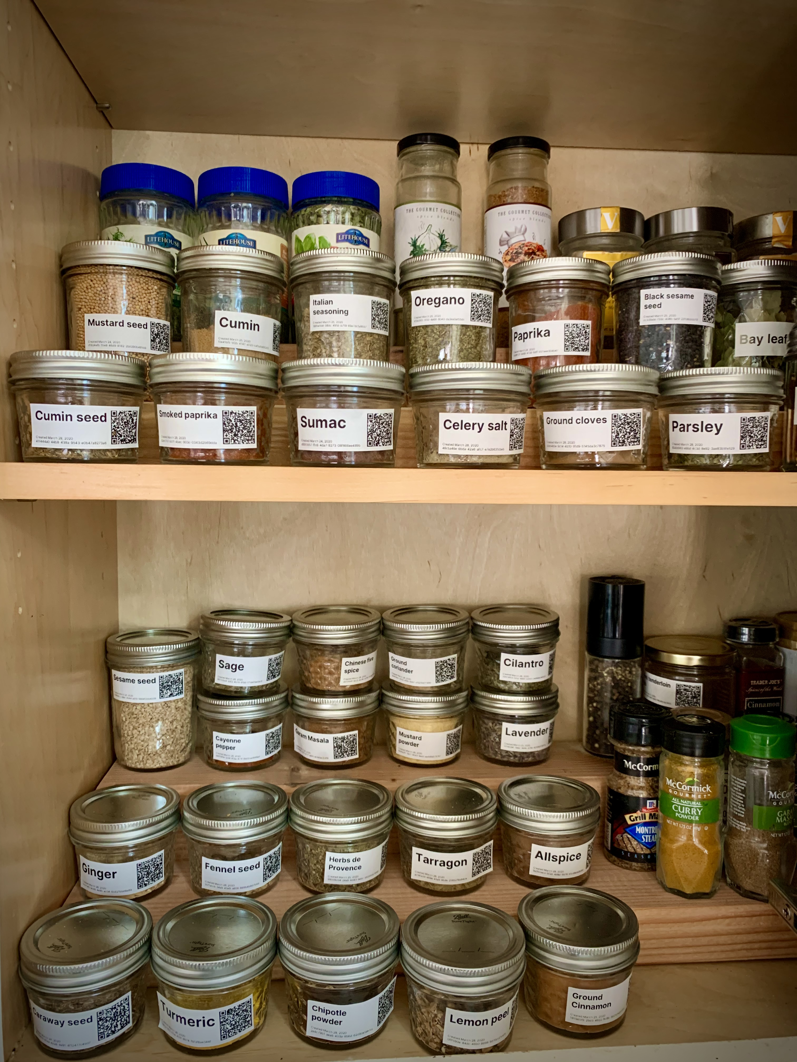 A spice rack organized on 2x4's and 4x4's